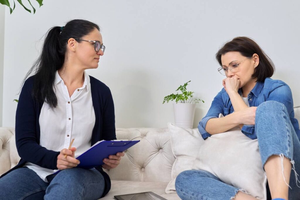 woman talking to therapist about midlife crisis