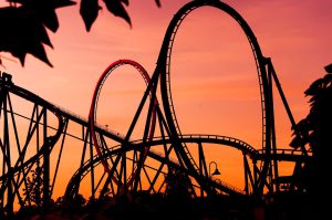 rollercoaster with red background to symbolize emotional rollercoaster for women