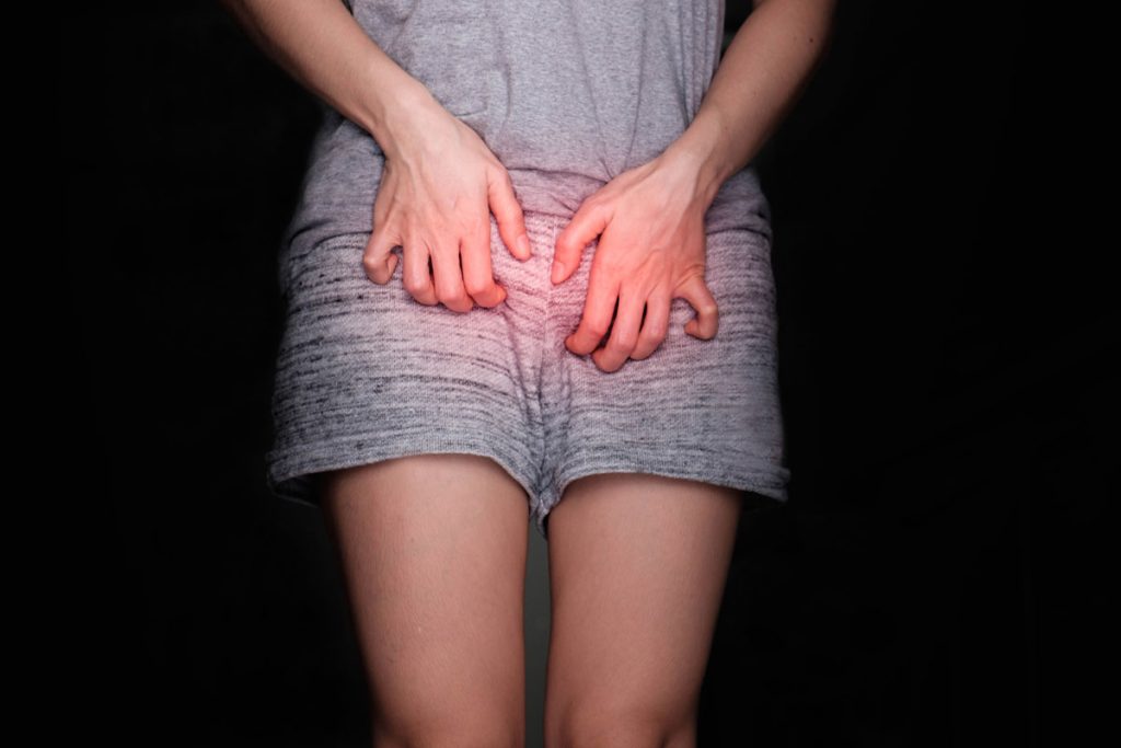 woman itching her vagina