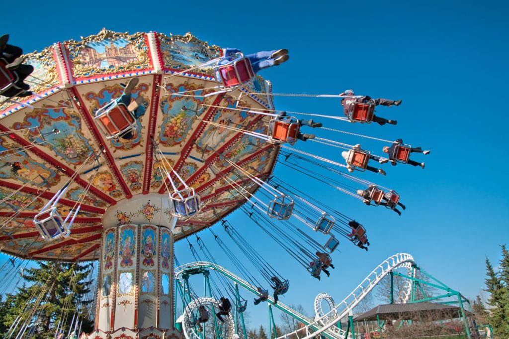 swings at amusement part to symbolize mood swings