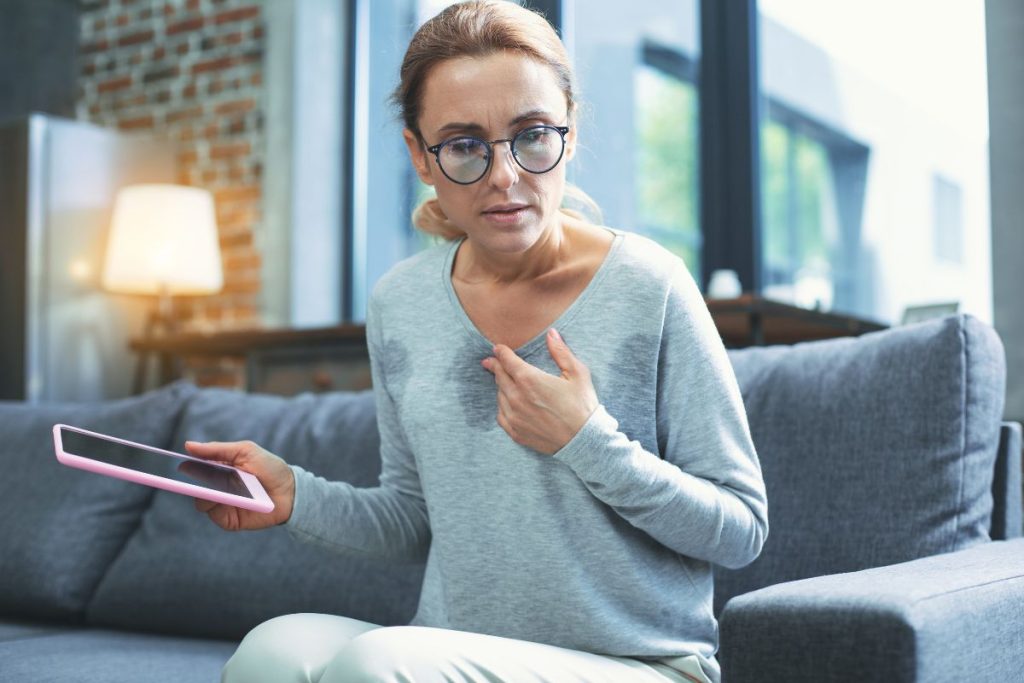 woman sweating from a hot flash