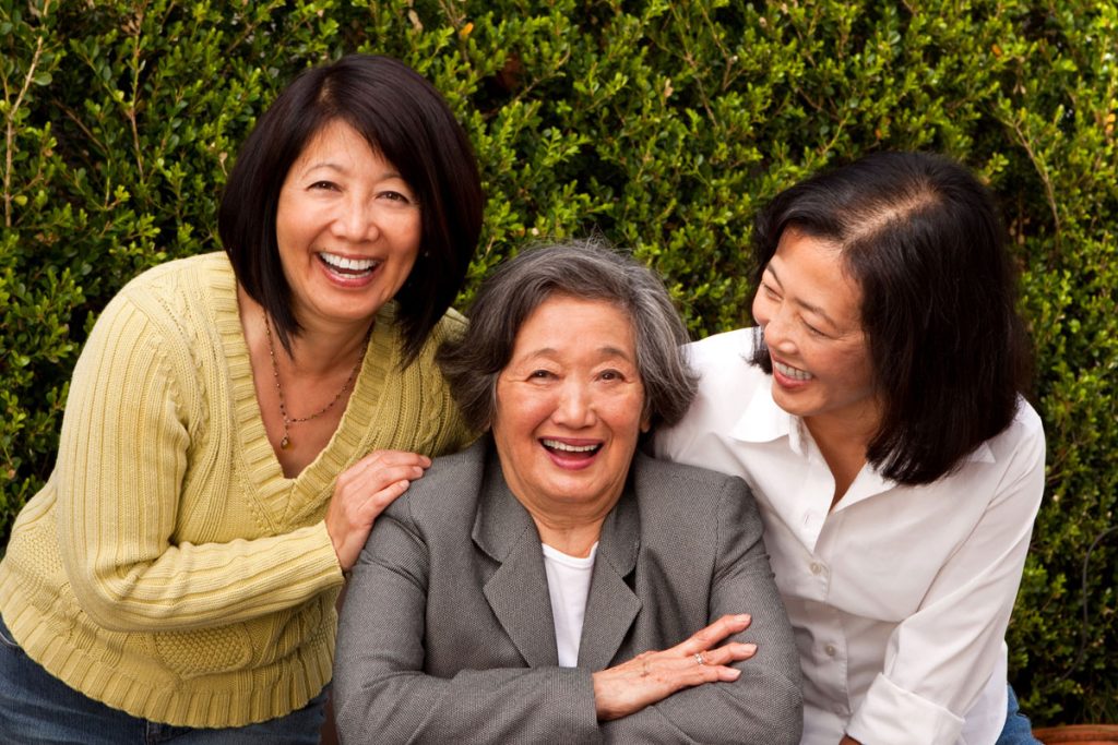 Asian women in family smiling