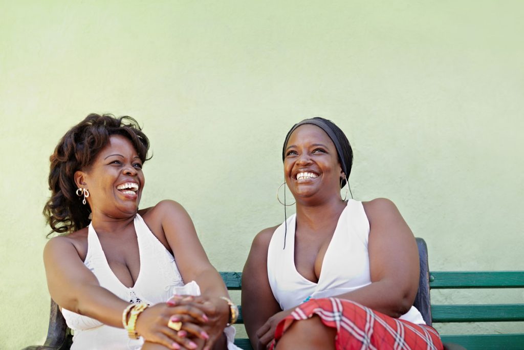 friends laughing and supporting each other