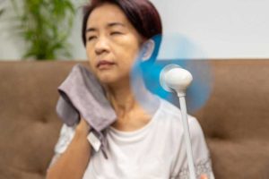 menopausal woman having a hot flash