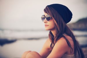 woman at beach thinking about future of early menopause