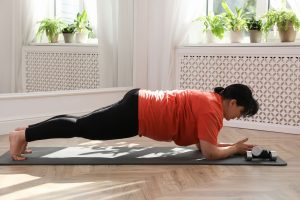 woman doing a pilates plank exercise