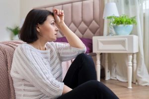 woman experiencing menopause symptoms