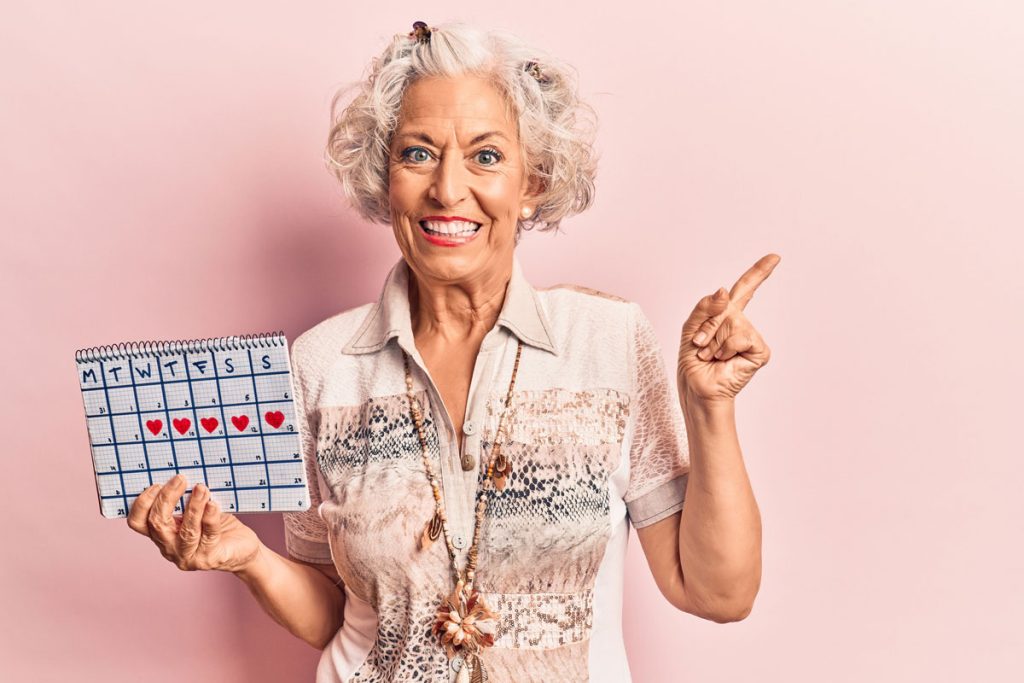 woman holding menstruation calendar