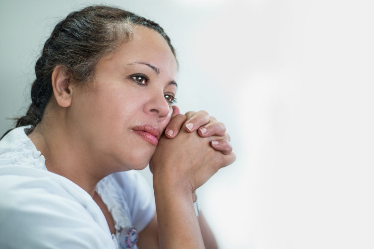 hispanic woman looking depressed