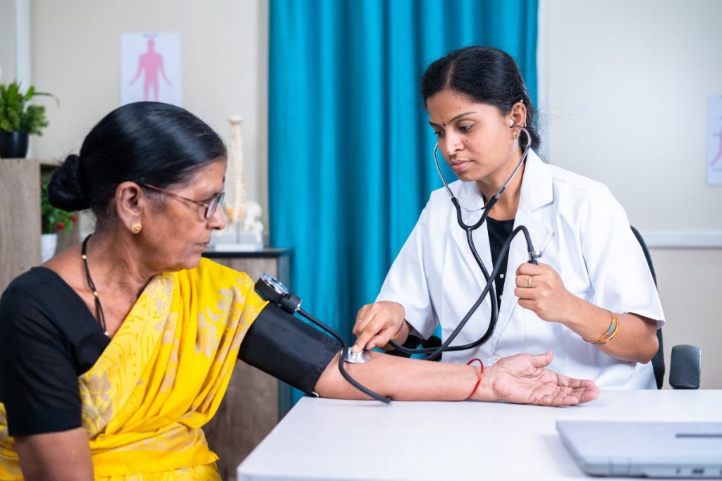 Indian woman having her blood pressure checked for heart health