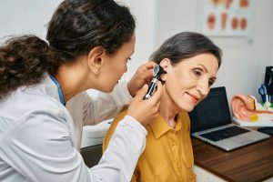 woman having her ears checked for hearing loss