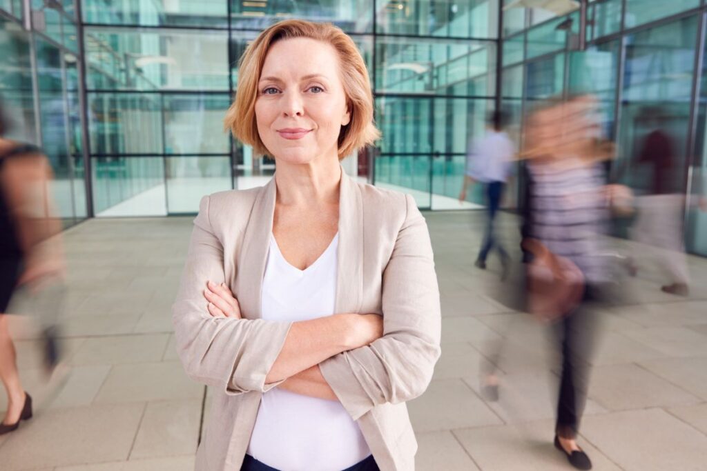 Confident woman at work who feels supported by employer
