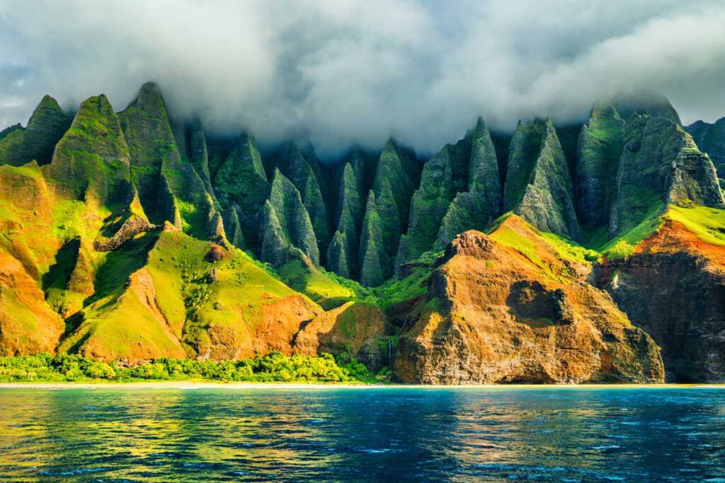Hawaiian landscape in Kauai coastline with fog over mountains