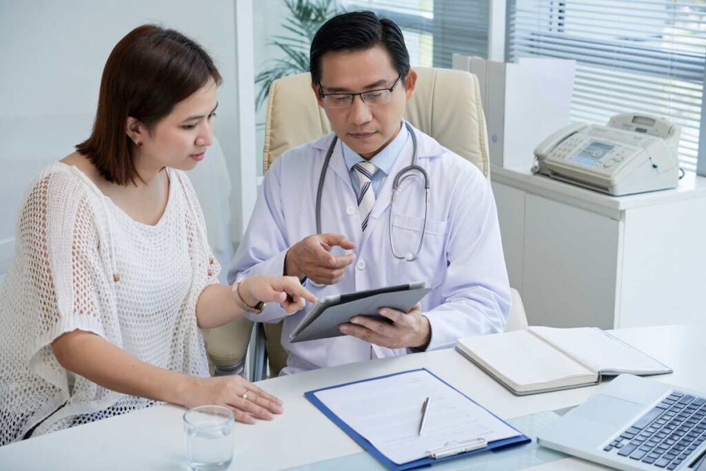 Vietnamese doctor talking to doctor