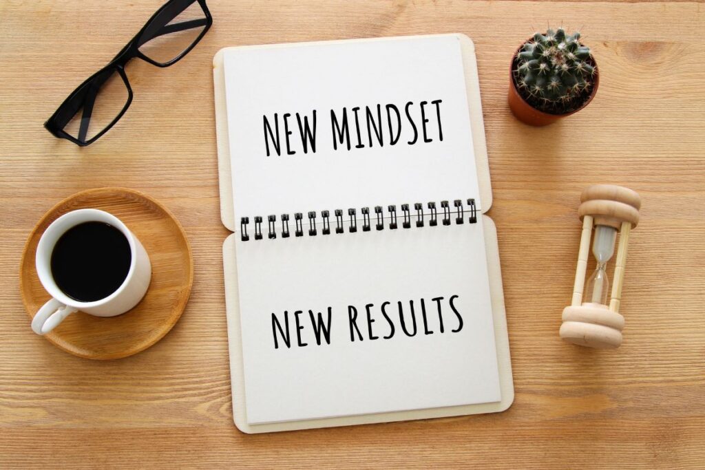 New mindset new results written on notepad for woman looking to change mindset