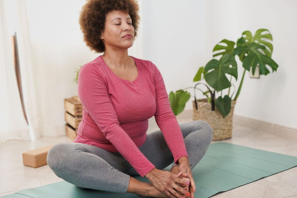 woman practicing mindfulness in her house