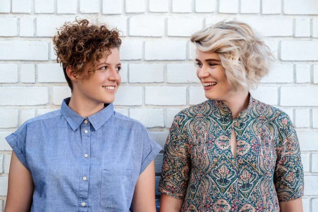LGBTQ couple looking at each other ready to strengthen their relationship