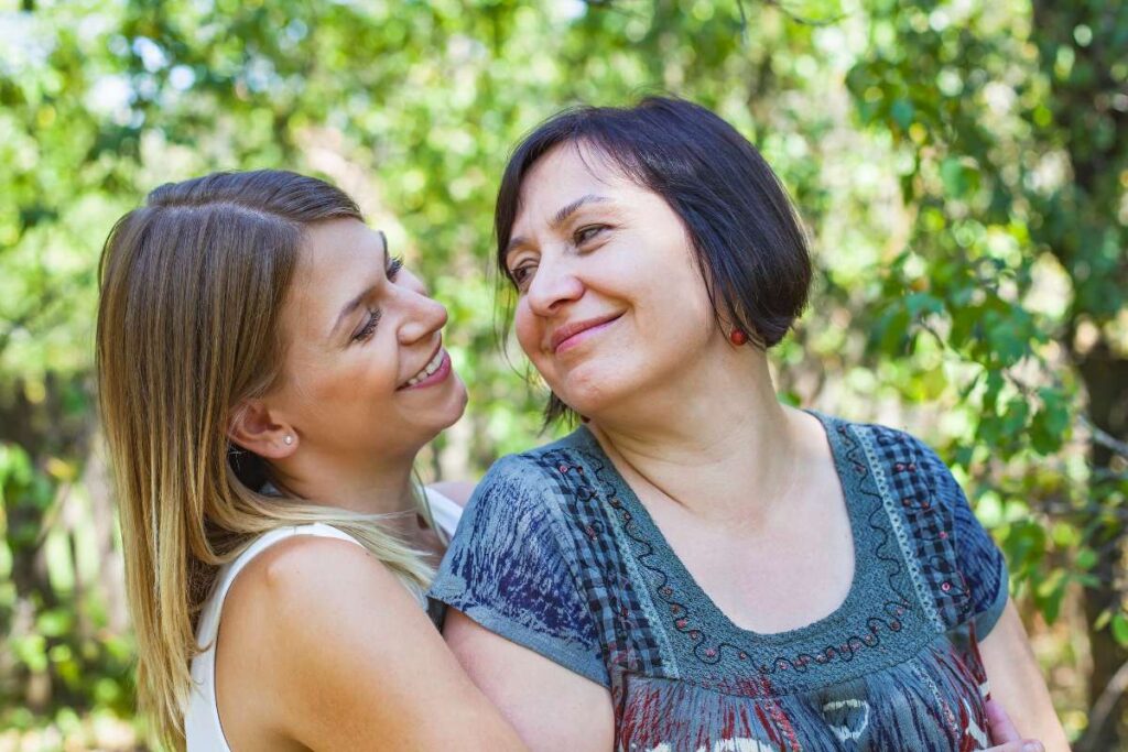 LGBTQIA women smiling at each other