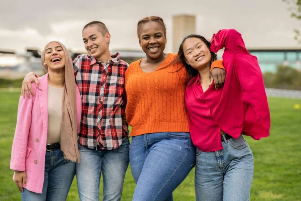 lesbian women celebrating their body image in the park