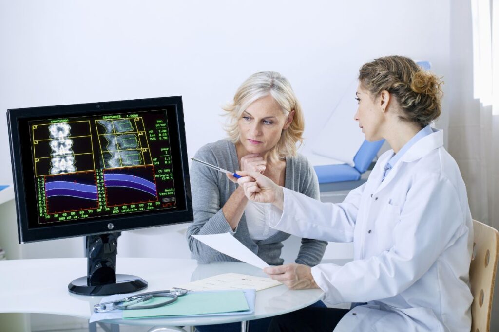Doctor reviewing bone density test