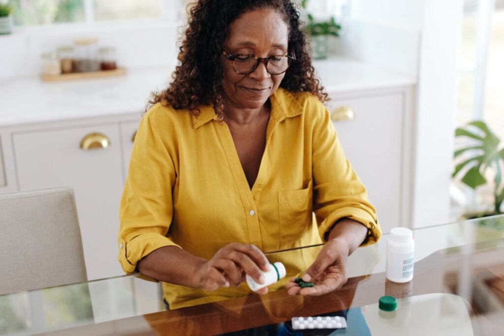 Woman sorting osteoporosis medications