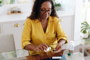 Woman sorting osteoporosis medications