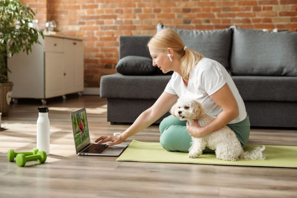 Woman looking at computer for at-home osteoporosis exercise videos