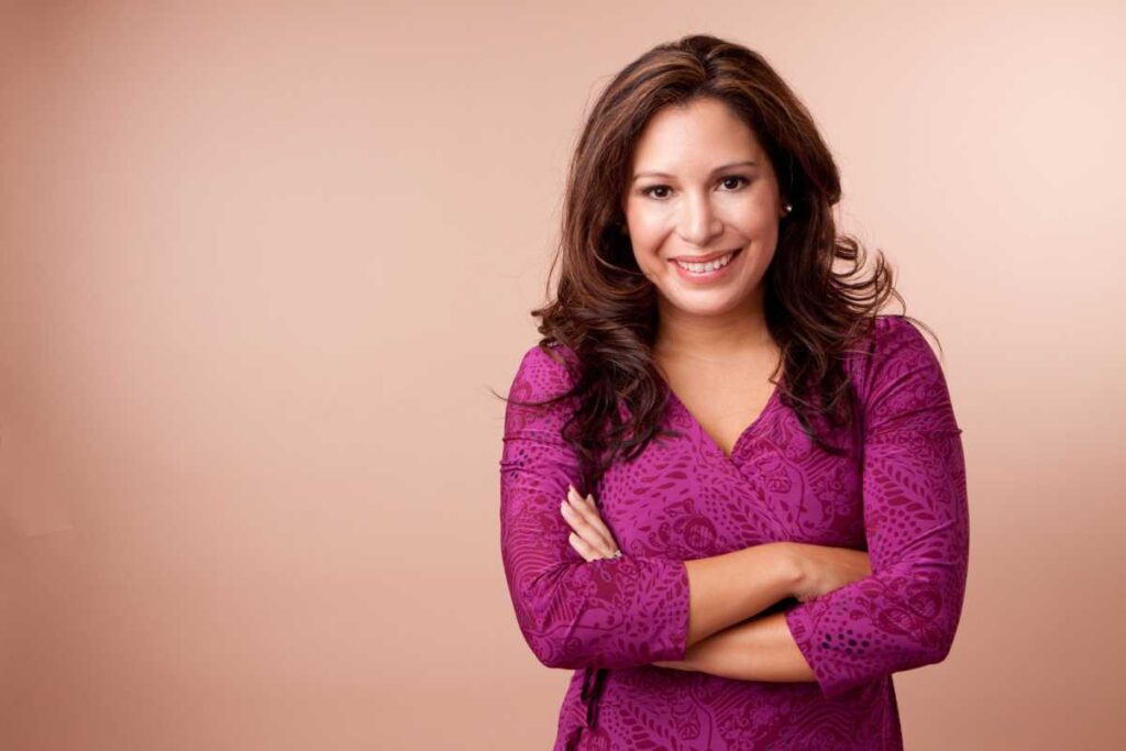 Latina woman with hands folded ready to take charge of her life