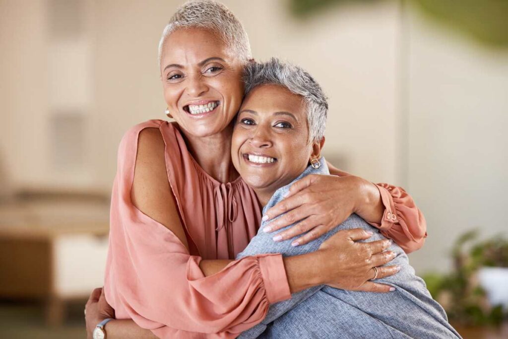Menopausal lesbian women hugging