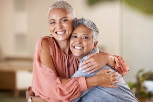 Menopausal lesbian women hugging