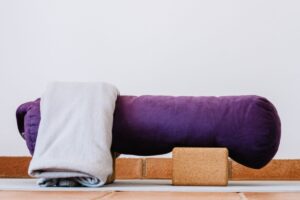 Restorative yoga equipment bolster and towel