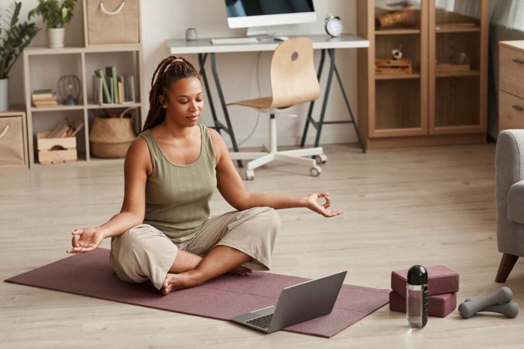 woman practicing yoga at home