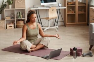 woman practicing yoga at home