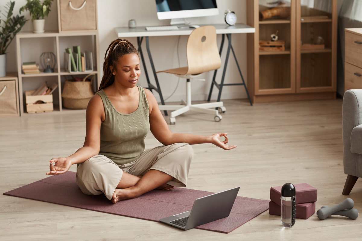 woman practicing yoga at home
