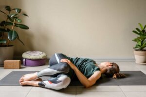 supine spinal twist yoga pose