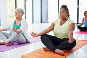 women practicing yoga
