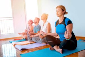 women practicing yoga at a studio
