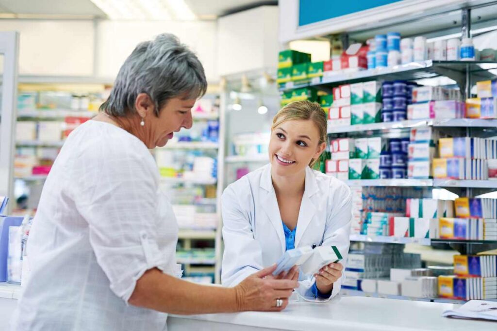woman talking to her pharmacist