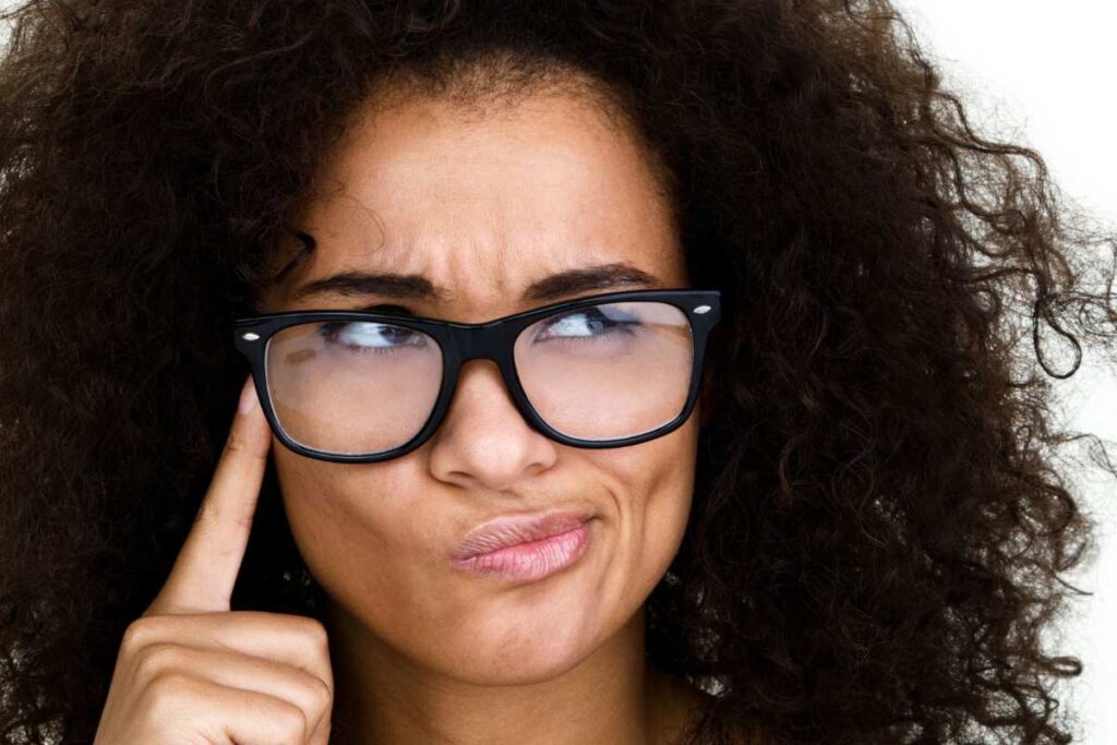 woman hand on face thinking