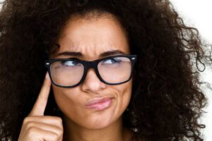 woman hand on face thinking