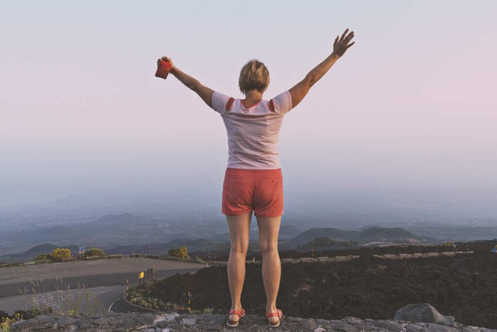 woman on top of a mountain